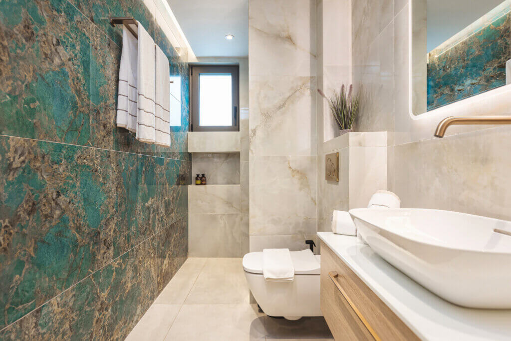 Step into a sanctuary of modern luxury in Ensuite Bathroom, where crisp lines meet warm tones.