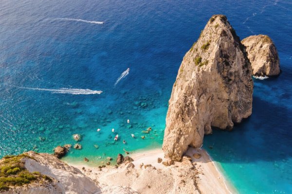 aerial drone view ionian sea coast zakynthos greece rocky ridge beach floating boats Large qlamyik4vqlu8v1aifvwi78ig2mtbhf1kikagkqisg